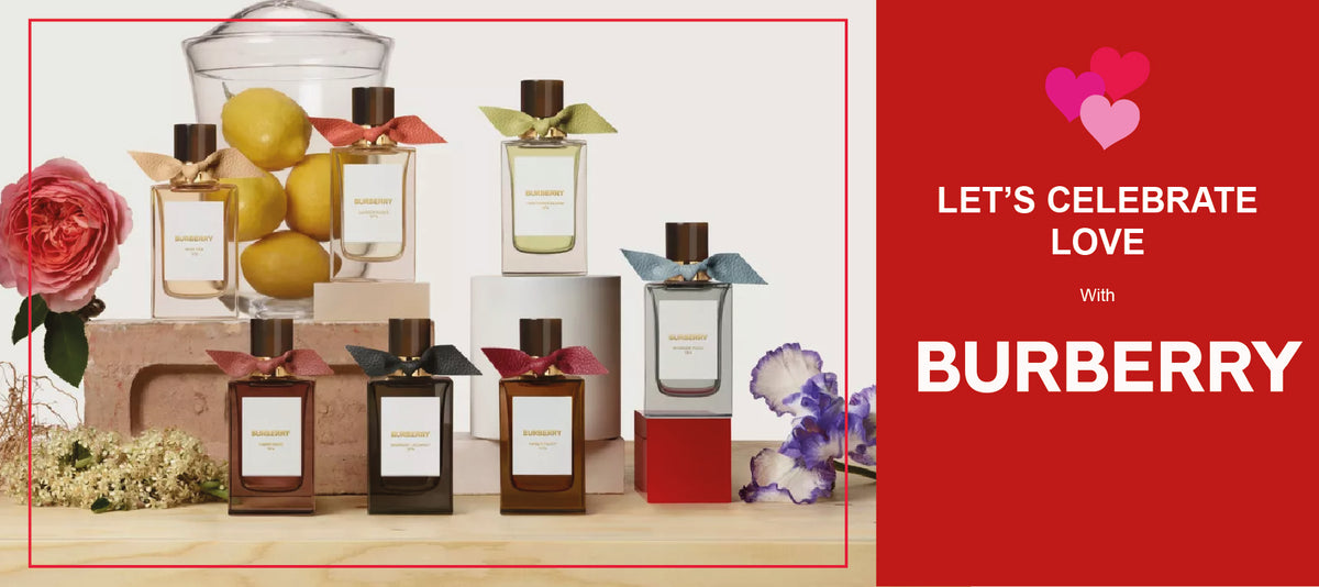Six Burberry perfume bottles, each with a colored bow, are arranged among lemons, flowers, and gift boxes. The right side features red background text: LETS CELEBRATE LOVE With BURBERRY, with pink and red heart graphics.