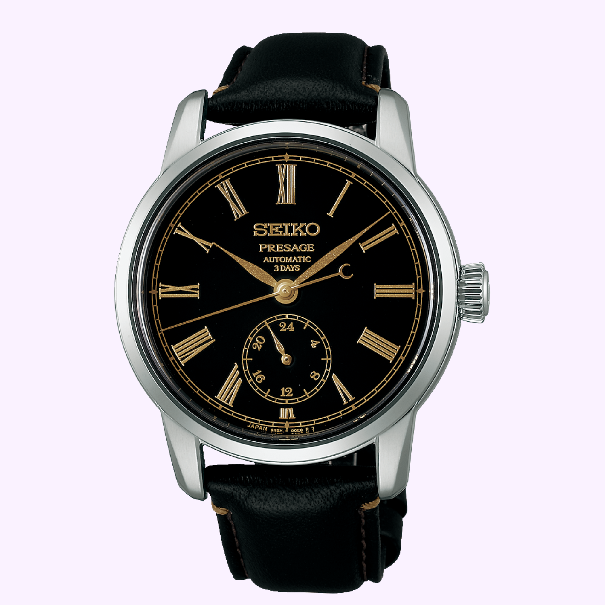 A Seiko Luxe Watches Presage Craftsmanship Series Enamel SPB499 automatic wristwatch featuring an elegant black enamel dial, gold Roman numerals, a subdial at 6 o’clock, and a refined black leather strap. The case is silver with a ridged crown on the right side—an exquisite example of Seiko Luxe Watches’ renowned craftsmanship, powered by an automatic movement.