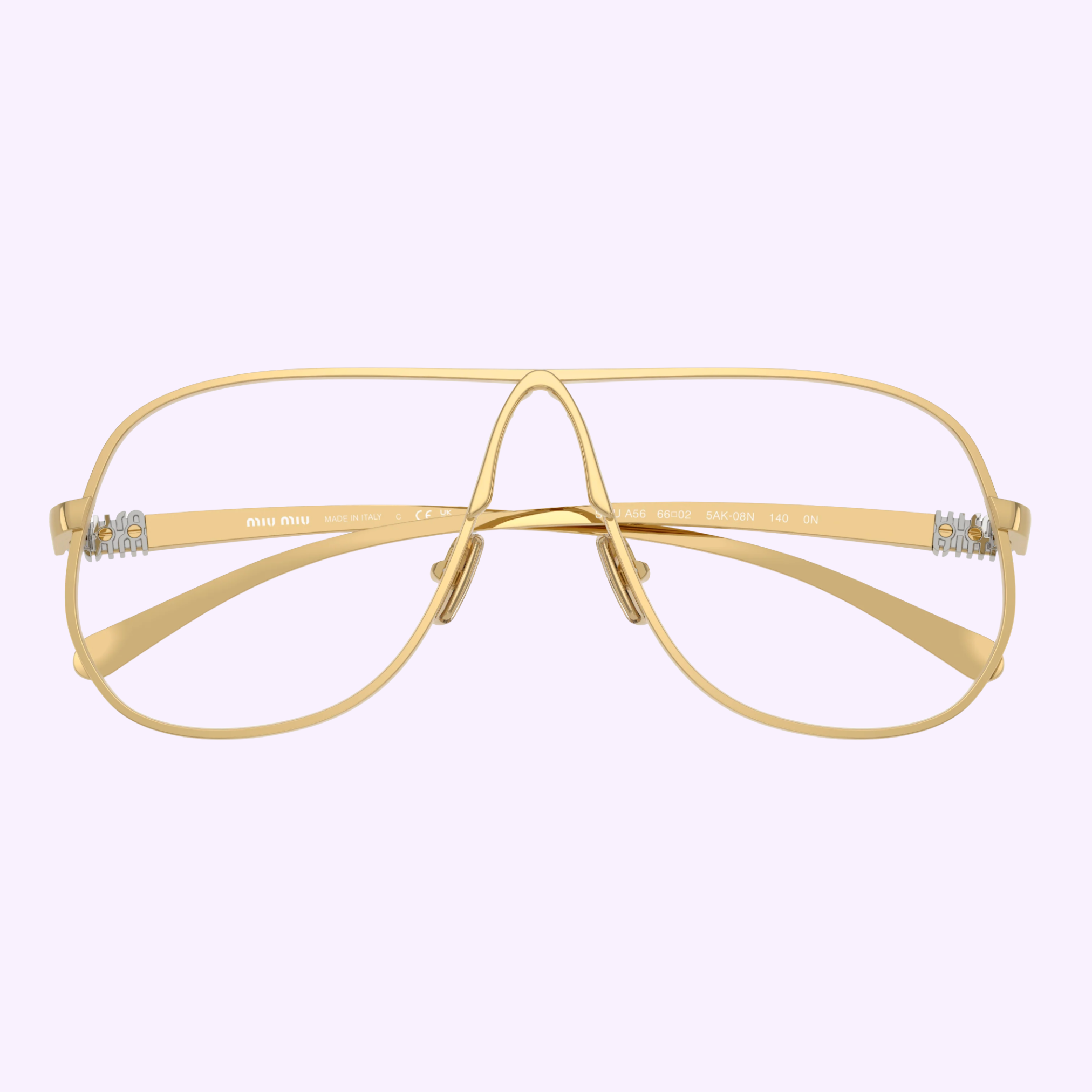 The Miu Miu 0MU Optical Frames 0MU A56S 5AK08N66 by Miu Miu Sunglasses feature gold wireframe aviator-style rims, an open bridge, and clear nose pads, shown against a plain light purple background.