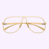The Miu Miu 0MU Optical Frames 0MU A56S 5AK08N66 by Miu Miu Sunglasses feature gold wireframe aviator-style rims, an open bridge, and clear nose pads, shown against a plain light purple background.