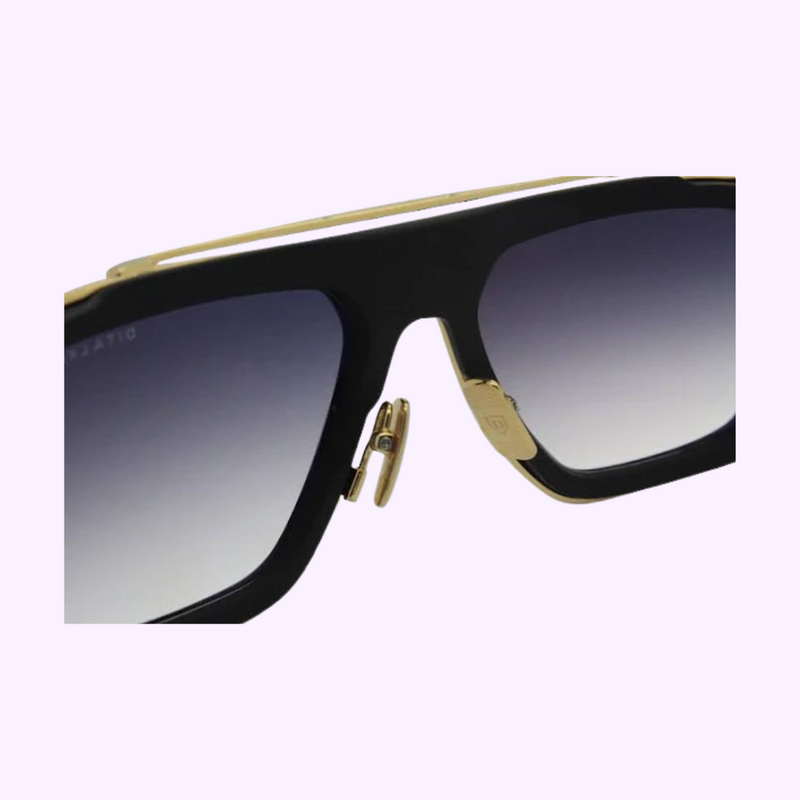 Close-up of DITA LXN-EVO DTS403-A-01 showing the gold titanium brow bar, double bridge and gradient tinted lenses