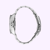 Side view of the Seiko Watches SRPE33 Prospex Silver Men's Watch with a round case and stainless steel strap, displayed upright against a light purple background.