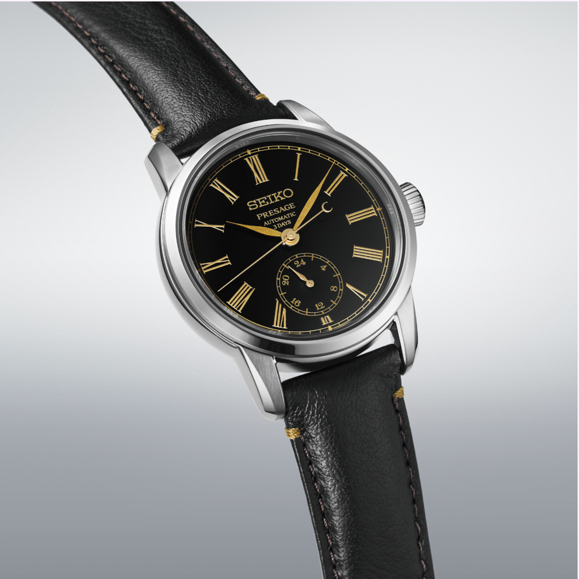 The Seiko Luxe Watches Presage Craftsmanship Series Enamel SPB499 features a striking black Urushi lacquer dial with gold Roman numerals and a small seconds subdial. Powered by an automatic movement, this watch comes with a stainless steel case and a black leather strap.