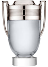 A clear glass trophy with silver handles and matching accents, mirroring the iconic style of the Paco Rabanne Invictus 2PC Travel Set For Men from Paco Rabanne Perfumes.