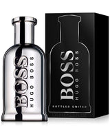 A silver bottle of Hugo Boss Bottled United 3.3 oz EDT for Men Perfume by Hugo Boss Perfumes stands next to its black box, both featuring the bold BOSS HUGO BOSS logo—a standout men's fragrance.