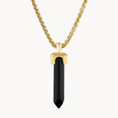 The Bulova Jewelry Icon Pendant BVP1017-YSBA (UPC: 042429596061) is a gold-plated necklace with a long faceted black onyx pendant capped in gold, displayed elegantly against a plain white background.