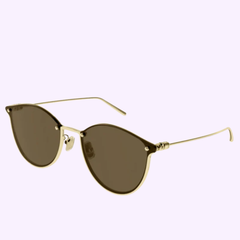 The Boucheron BC0119S 003 61 Women Sunglasses by Boucheron Sunglasses are showcased against a light lavender background, featuring gold-framed round designer lenses with a thin, lightweight construction. The elegant design includes simple nose pads and slender arms, embodying the sophistication of luxury sunglasses.