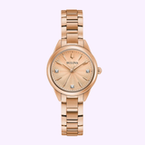 The Bulova 97P151 Sutton Rose Gold Stainless Steel Strap Women’s Watch from Bulova Watches features a round face, minimal hour markers, and four crystal accents, shown on a plain light background.