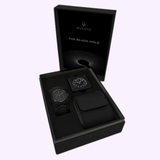 The Bulova Watches Lunar Pilot Black Hole 98A335 Limited Edition set includes two black watches and an accessory case in a sleek black gift box with matching packaging.