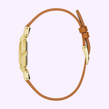 Side view of a gold-tone stainless steel Bulova Watch Goddess of Time - Jackie 97L202 featuring a thin tan leather strap.