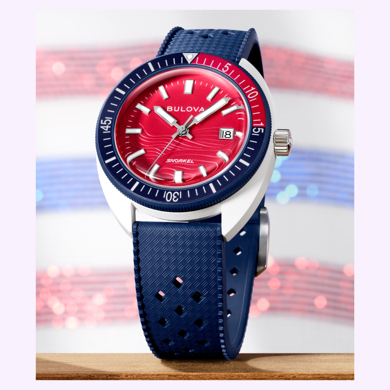 Bulova Snorkel 98B474 lifestyle shot with red and blue wave background