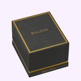 Black Bulova Watch Maquina 97A207 box with gold trim and gold lettering on the lid and front.