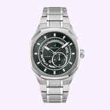 Bulova Watch Marc Anthony Surveyor 96A346 stainless steel automatic men’s watch with a dark green dial featuring an open-heart design, a sub-dial for seconds, and luminous markers.