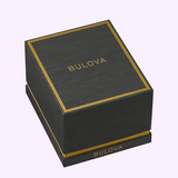 Black rectangular Bulova Watch Marine Star 98b467 watch box with gold trim and the brand name printed on the lid and side.