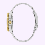 Side view of a silver and gold-tone Bulova Watch Marine Star 98b467 with a gold-tone bezel and crown.