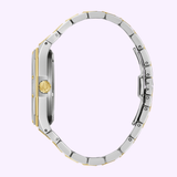 Side view of the Bulova Watch Prestige Automatic 98A339 by Bulova Watches, with a gold and silver-tone stainless steel link band and round crown, set against a pale purple background.