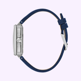 Side view of the Bulova Watches Series X Automatic 98A342, featuring a silver stainless steel case and blue leather strap, displayed with the buckle up against a light purple background.