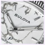 Close-up of a Bulova Watches Super Seville Magnesite 96A344 watch face featuring a white magnesite dial, silver hour markers and hands, with part of the bezel visible at the top right.