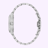 A Bulova Watches Super Seville Magnesite 96A344 silver metal wristwatch is shown from the side, highlighting its round case, crown, and linked bracelet against a light purple background. The watch face and magnesite dial are not visible.