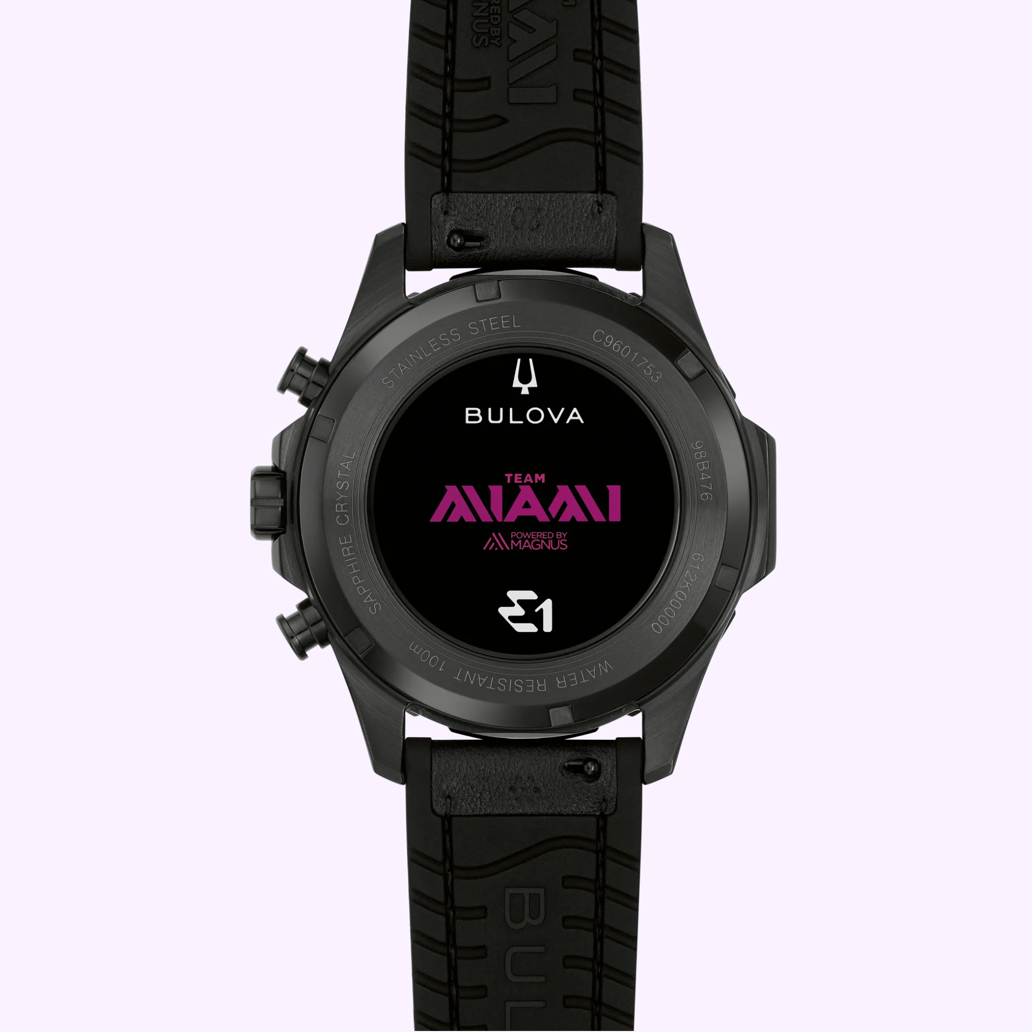 Bulova Watches E1 Team Miami 98B476 (UPC 042429609013) displayed face-down on a light purple background, featuring TEAM AVAALI in pink text and multiple logos on the back case, with a black rubber strap—a special edition inspired by electric boat racing watch designs.