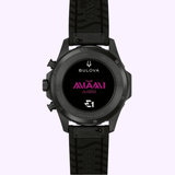 Bulova Watches E1 Team Miami 98B476 (UPC 042429609013) displayed face-down on a light purple background, featuring TEAM AVAALI in pink text and multiple logos on the back case, with a black rubber strap—a special edition inspired by electric boat racing watch designs.