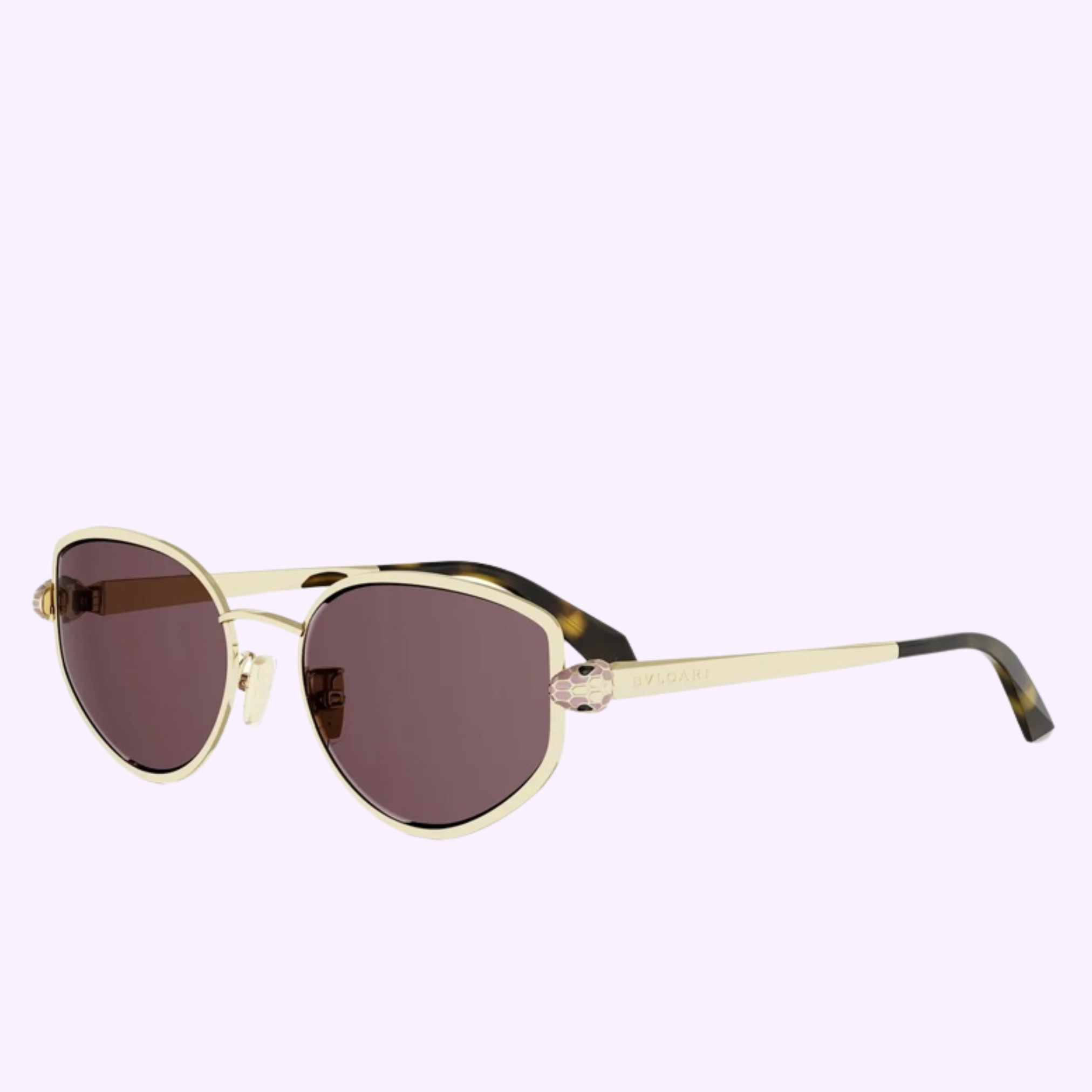 Bvlgari Sunglasses BV40085U 5533Y with gold frames, dark brown lenses, and black ear tips displayed at an angle on a light purple background.