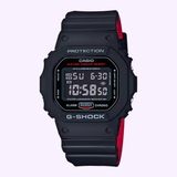 The G-Shock Watches 5600 SERIES DW5600HR-1 features a black resin band, rectangular digital display with time and date, red accents, and "PROTECTION" and "G-SHOCK" on the bezel.