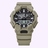 Tan G-Shock Watches CASIO G-Shock Watch Analog-Digital GA010-5A featuring a rugged design with multiple buttons and a digital display showing Sunday, 6:30. Enhanced by the advanced Carbon Core Guard structure for superior durability and boasting a 10-year battery life, its watch face displays time, date, and various function indicators.