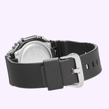 A close-up shows the back of the G-Shock Watches CASIO G-STEEL GM-2100-1ASW with a black textured strap and silver buckle, set against a light purple background.