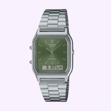 The G-Shock Watches CASIO Watch AQ230A-3A features a silver metal band, green analog face, and a small digital display at the bottom for date and time.