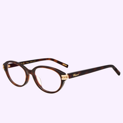 CHOPARD Optical VCH446S532BLY tortoiseshell oval eyeglasses featuring gold-toned metal accents at the hinges.