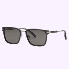 CHOPARD Sunglasses SCH375 57705P by Chopard Sunglasses feature a rectangular black frame, dark tinted lenses, and silver temple accents, showcased on a light purple background. UPC: 190605562987.