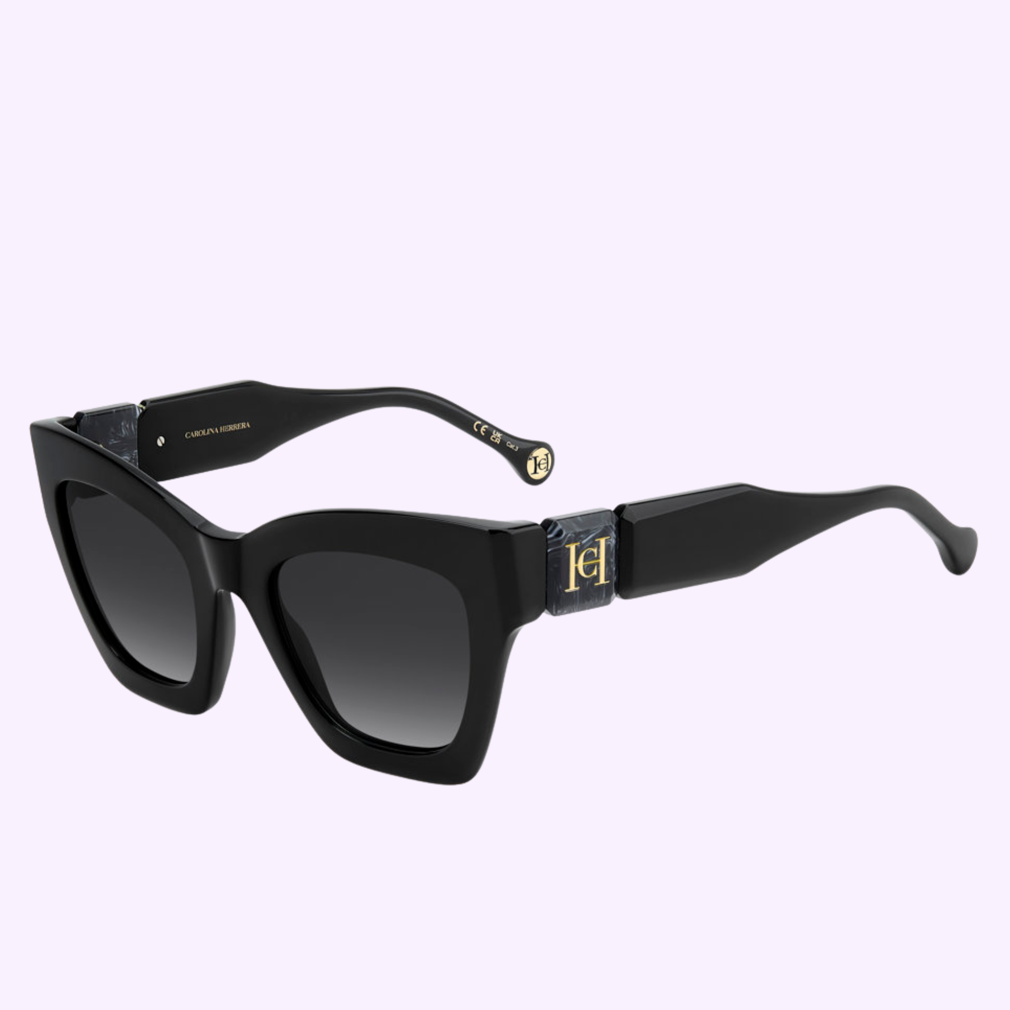 Carolina Herrera Sunglasses HER 0327/S 807 BLACK feature black cat-eye frames, dark gradient lenses, and gold-accented arms from the Carolina Herrera Sunglasses collection, shown on a light purple background.