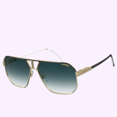 Set against a light purple background, the Carrera Sunglasses CARRERA 1062/S 2M2 (UPC: 716736851426) feature gold-rimmed aviator frames, blue gradient lenses, and striking black-and-white arms. These square sunglasses reflect the timeless style and modern design inspired by Carrera Sunglasses’ renowned CARRERA 1062/S collection.