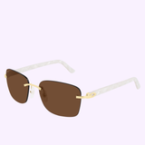 The Cartier CT0034RS 001 56 Unisex Sunglasses by Cartier Sunglasses feature brown square lenses with gold and pearl-white arms, set against a pale lavender background—these luxury sunglasses are the epitome of timeless style and sophistication.