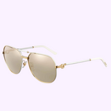 The Cartier CT0053S 003 55 Unisex Sunglasses by Cartier Sunglasses feature gold aviator frames, light brown tinted lenses, and white temple arms, shown against a light purple background for a luxurious look.