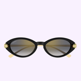 Cartier Sunglasses CT0634S-001 52 feature a black oval frame with gold-accented corners and gradient lenses, elegantly presented on a light purple background.
