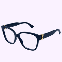 The Cartier Optical Frame CT0451O-003 55 for women, in navy blue with thick frames and gold hinge accents, is displayed on a light purple background, showcasing the refined elegance of Cartier Optical eyewear.