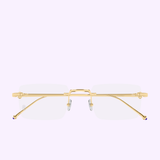 The Cartier Optical Frames CT0619O-001 52 by Cartier Sunglasses feature gold rimless rectangular lenses with slender temples and clear nose pads, showcased against a light pastel background from a front-facing perspective. Inspired by timeless design, these luxury eyeglasses embody refined elegance and add sophisticated appeal to any ensemble.