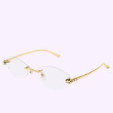 Cartier Optical Frames CT0637O-001 56 by Cartier Sunglasses showcase gold rimless eyeglasses with oval transparent lenses, slim gold arms, and striking leopard-print accents near the hinges—presented against a light purple background for an unmistakably luxurious statement.