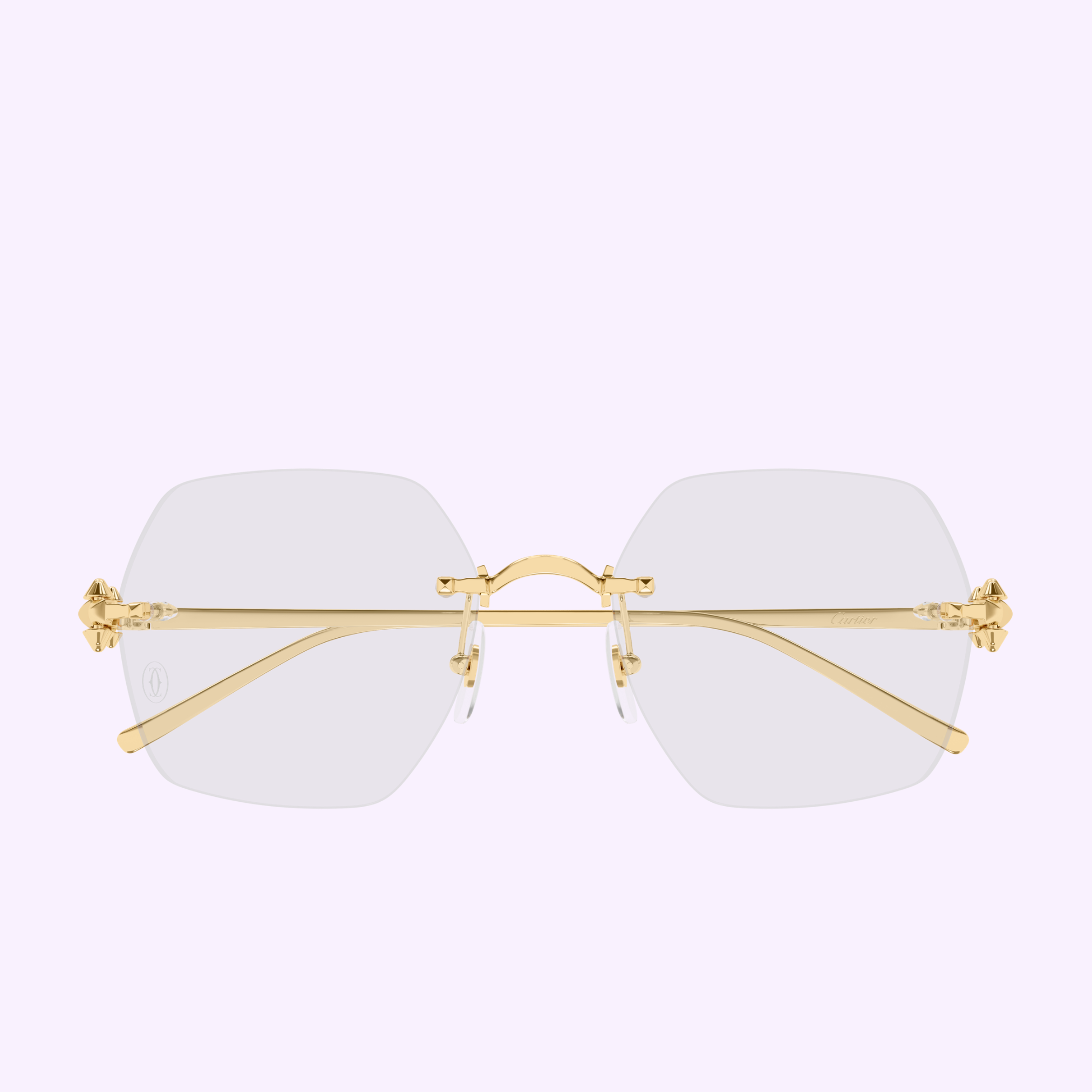 Cartier Optical Frames CT0646O-001 54 Women by Cartier Sunglasses feature rimless hexagonal clear lenses, a gold metal bridge and temples, plus luxury hinge accents, displayed on a light purple background.