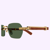 Side view of Cartier Sunglasses CT0362S-002 54 Unisex featuring rimless green lenses, gold accents, and sophisticated brown wood temples by Cartier Sunglasses, set against a light purple background.