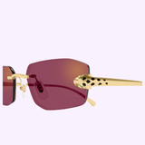 Close-up of Cartier Sunglasses CT0474S-002 56 by Cartier Sunglasses, featuring purple lenses and gold arms with a black spotted pattern, set against a light lavender background.