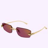The Cartier Sunglasses CT0474S-002 56 feature rimless rectangular purple lenses, gold metal arms, and animal print accents on the hinges and tips, exemplifying luxury eyewear. Displayed against a light lavender background, this model from Cartier Sunglasses makes a bold statement.