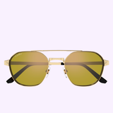 The Cartier Sunglasses CT0571S-004 52 by Cartier Sunglasses showcase gold frames, yellow-tinted lenses, black temple arms, and a double bridge, creating a distinctive luxury eyewear style against a light purple background.