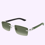 Cartier Sunglasses CT0582S-005 56 Men feature rectangular green lenses, a silver metal frame, and black arms—ideal luxury eyewear for men—displayed on a light purple background.