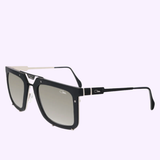 Discover the Cazal 648 002 56 Unisex Sunglasses by Cazal Sunglasses, featuring a stylish black and silver square design with gradient lenses, accented by a metal bridge and slender arms. Inspired by the iconic Cazal 648 style, these sunglasses showcase the Cartier logo on both the lenses and temples. Set against a light lavender background.