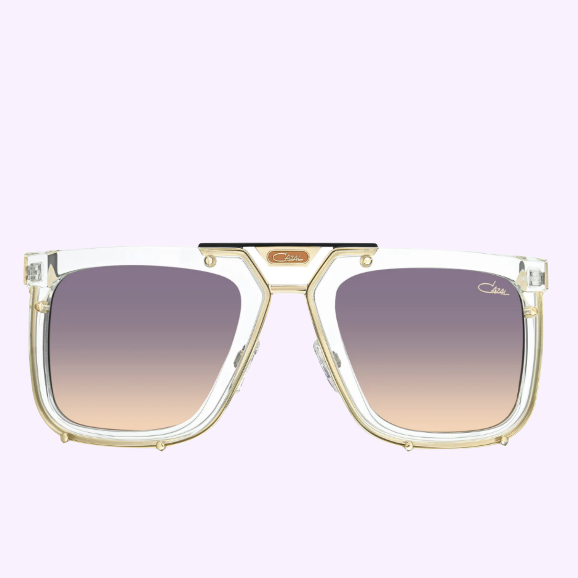 Cazal 648 004 MOD 648 LIMITED unisex sunglasses by Cazal Sunglasses, featuring clear frames with gold accents and gradient brown lenses, are displayed on a light purple background. Inspired by the iconic Cazal style, 