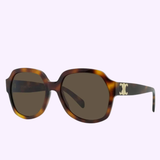 Celine CL40189F 53E 58 women’s sunglasses by Celine Sunglasses feature brown tortoiseshell frames, dark lenses with UV protection, and a gold logo on the arms, shown against a light lavender backdrop.