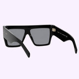Celine CL40092I 01A 60 women’s sunglasses by Celine Sunglasses, featuring black rectangular geometric frames with a thick, glossy finish and dark lenses, are displayed at an angle to reveal both the front and inside arms, set against a light lavender background.